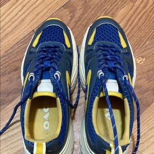 Coach sneakers almost new only worn 6 or 7 times ,leather